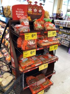 King's Hawaiian product display - dinner rolls, bread, hamburger buns, and hot dog rolls.